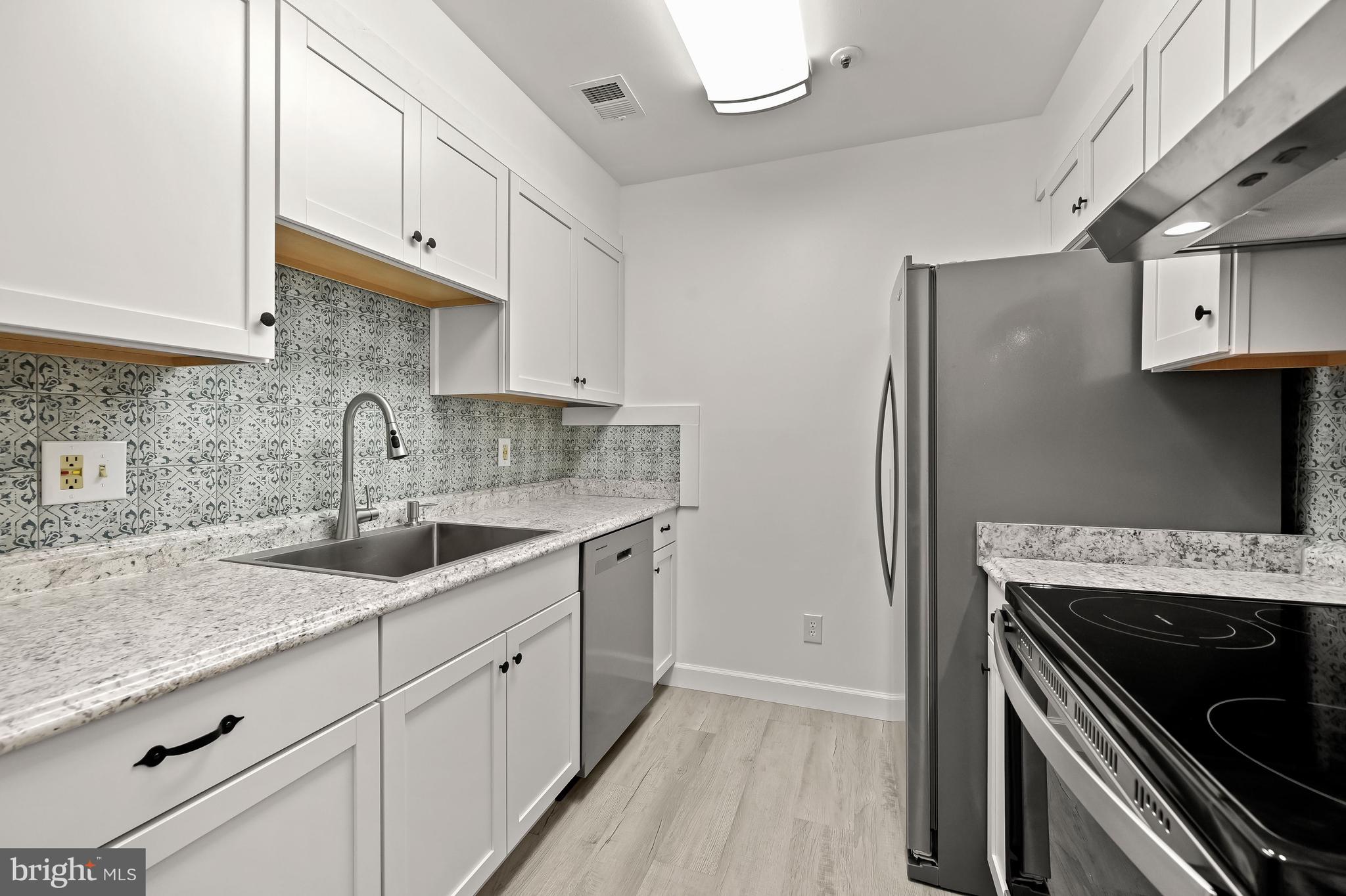 4904 Columbia Road, Unit 1 Columbia, MD 21044 - Photo 11 of 29 Renovated kitchen with Shaker cabinets