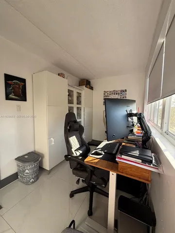 a room with furniture and a flat screen tv