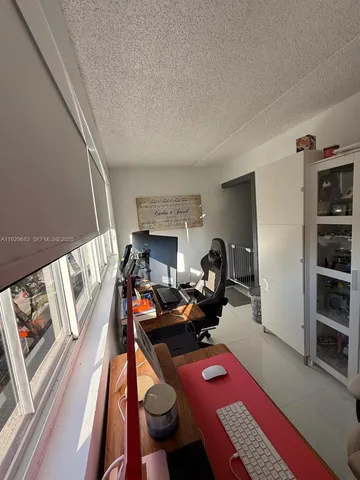 a bedroom with furniture and a wooden floor