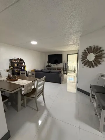 a view of a workspace with furniture