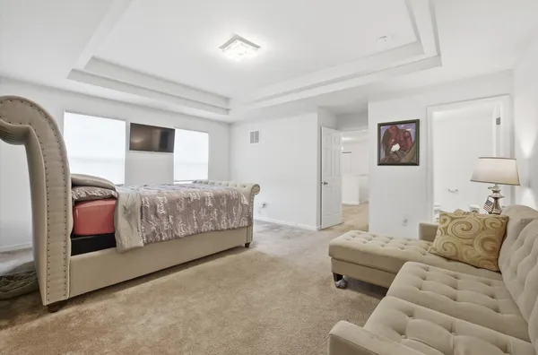 a bedroom with furniture and a couch
