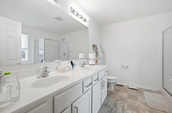a bathroom with a sink a vanity and a mirror
