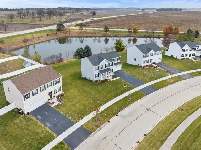 an aerial view of a house with a ocean view