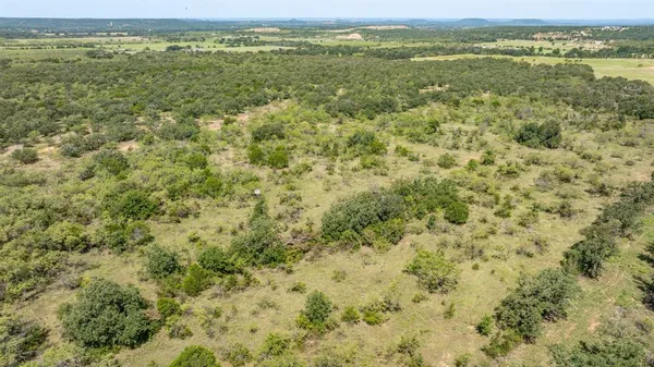 a view of a field with an outdoor space