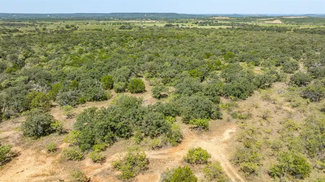 a view of a field with an outdoor space
