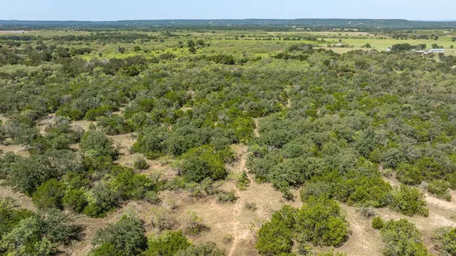 a view of a field with an outdoor space