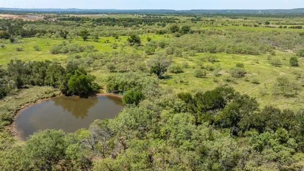 a view of a lake with a yard