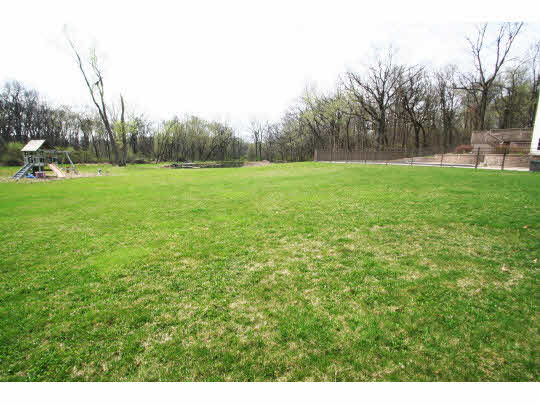8505 McCurry Road Roscoe, IL 61073 - Photo 11 of 11 a view of outdoor space with deck and yard
