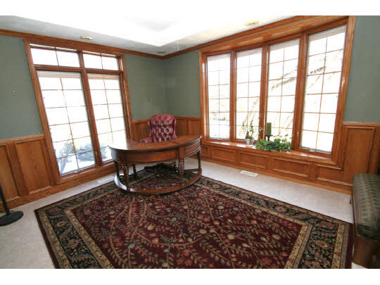 8505 McCurry Road Roscoe, IL 61073 - Photo 3 of 11 a living room with a couch and a table