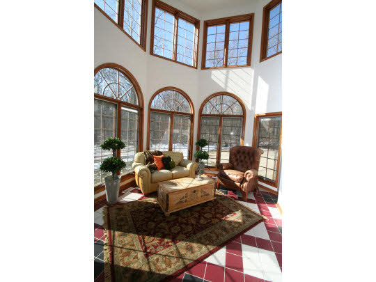 8505 McCurry Road Roscoe, IL 61073 - Photo 5 of 11 a living room with furniture and a large window