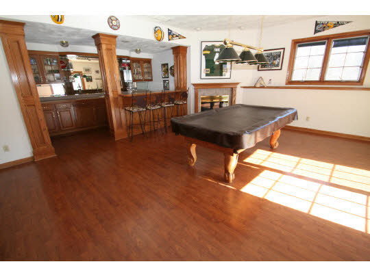 8505 McCurry Road Roscoe, IL 61073 - Photo 9 of 11 a living room with furniture a flat screen tv and a table