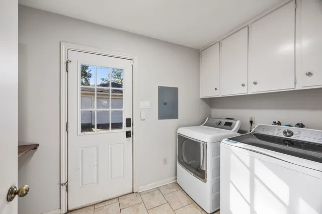 a utility room with closet dryer and washer