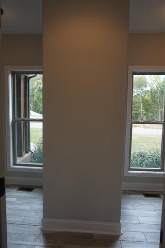 3 Old Clarksville Springfield Road Adams, TN 37010 - Photo 19 of 27 an empty room with wooden floor and windows