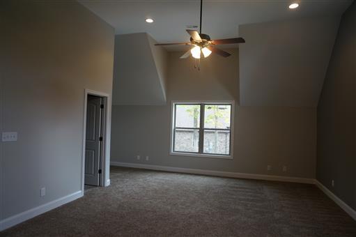 3 Old Clarksville Springfield Road Adams, TN 37010 - Photo 22 of 27 an empty room with windows and chandelier fan