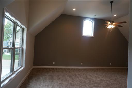 3 Old Clarksville Springfield Road Adams, TN 37010 - Photo 23 of 27 an empty room with windows and chandelier fan