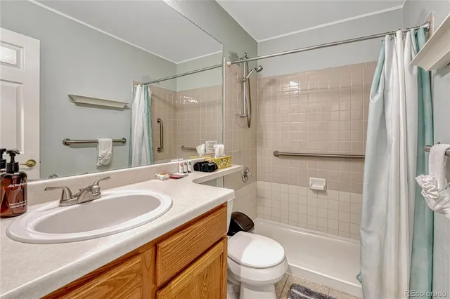 a bathroom with a sink toilet tub and shower
