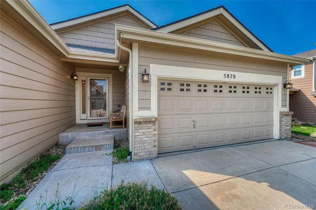 a front view of a house with garage