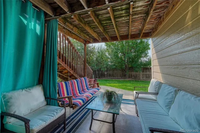 a view of a backyard with sitting area