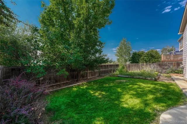 a view of a backyard with a garden