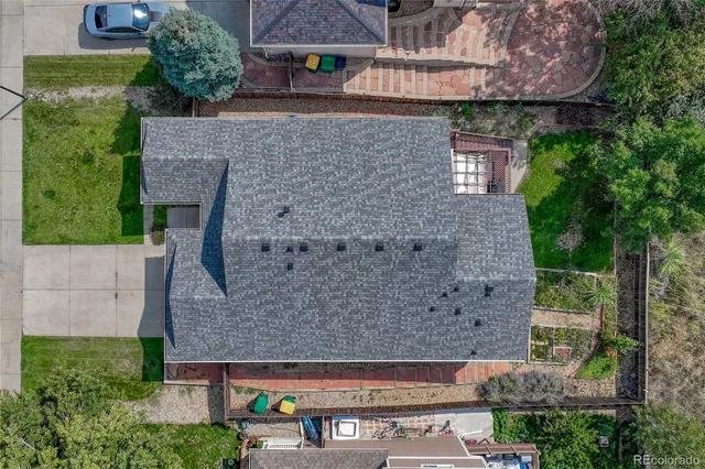 an aerial view of a house with a yard