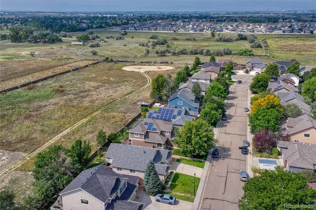 an aerial view of a house with outdoor space