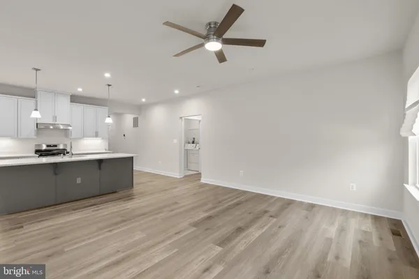 a view of kitchen with wooden floor and window