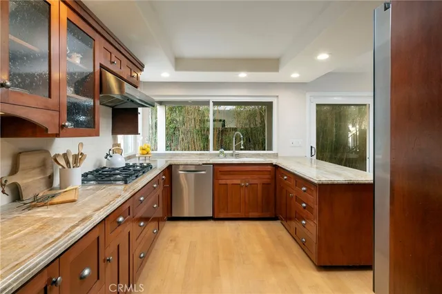 a spacious bathroom with a granite countertop sink and a large window