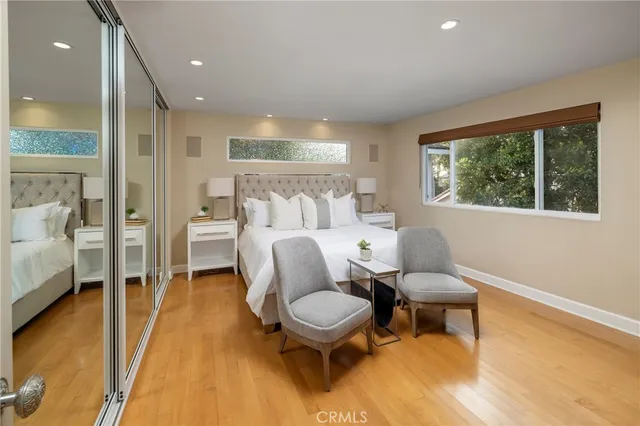 a bathroom with a granite countertop sink a mirror and shower