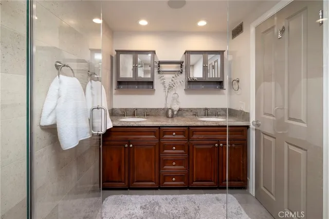 a spacious bedroom with a bed window and a table