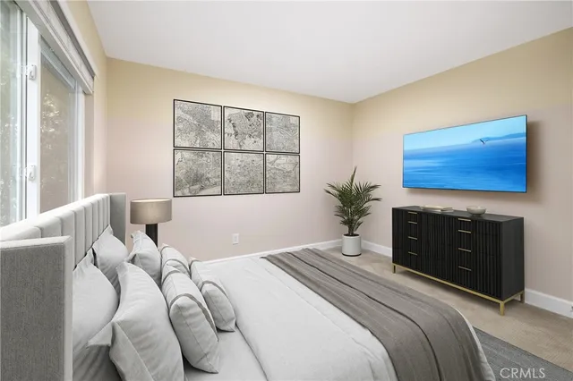 a view of a garden with potted plants and large trees