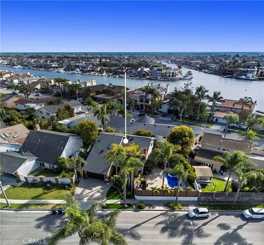 a living room with fireplace furniture and a large window