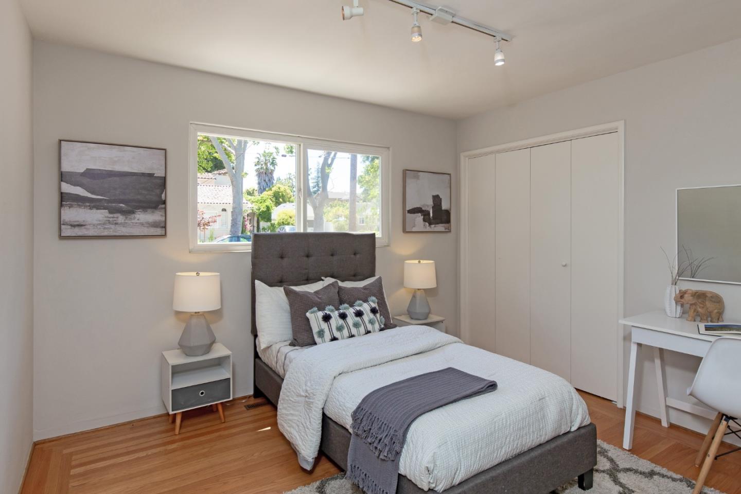 576 Bush Street Mountain View, CA 94041 - Photo 15 of 21 a bedroom with a bed and a window