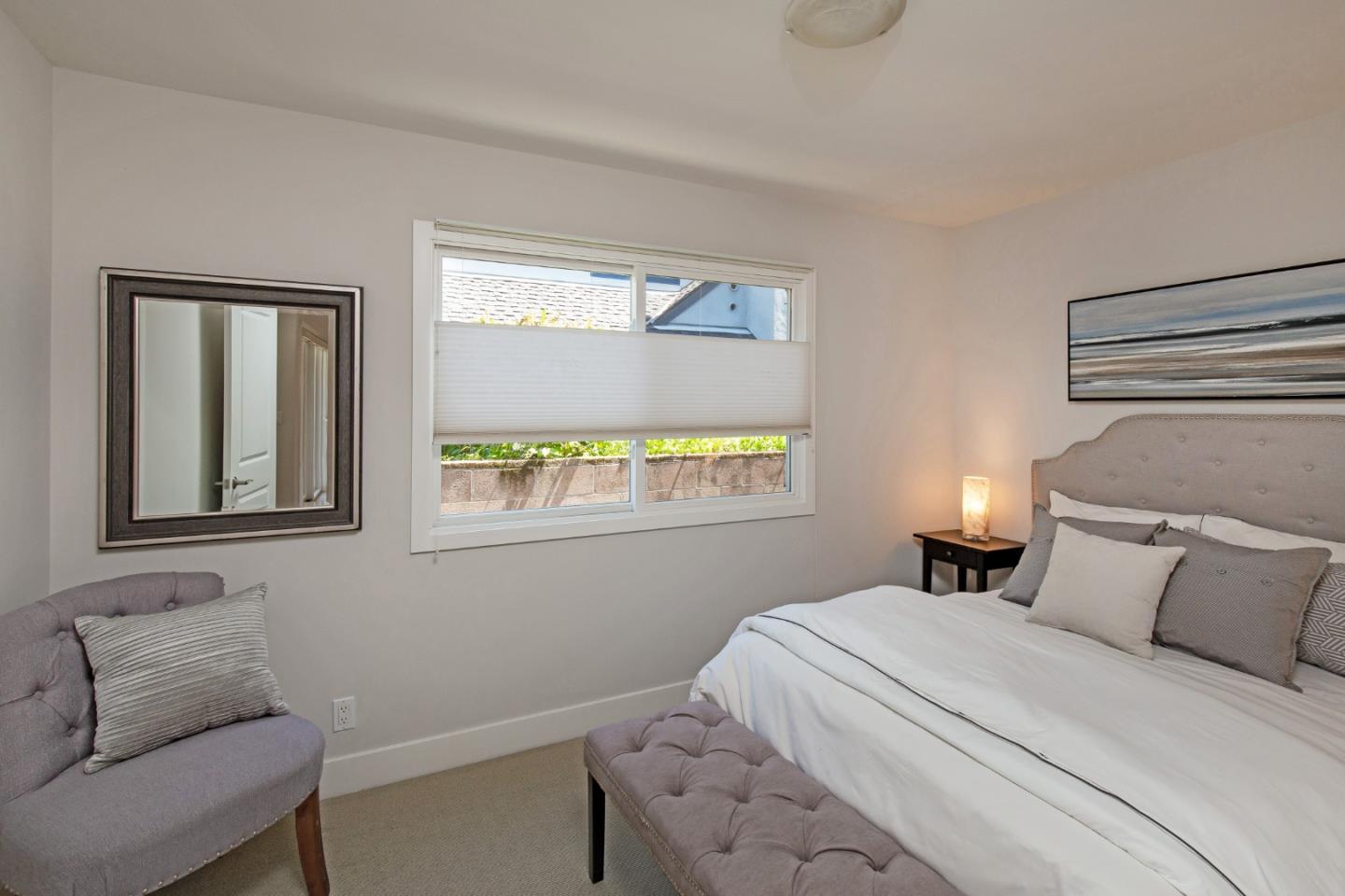 576 Bush Street Mountain View, CA 94041 - Photo 16 of 21 a bedroom with a bed and window