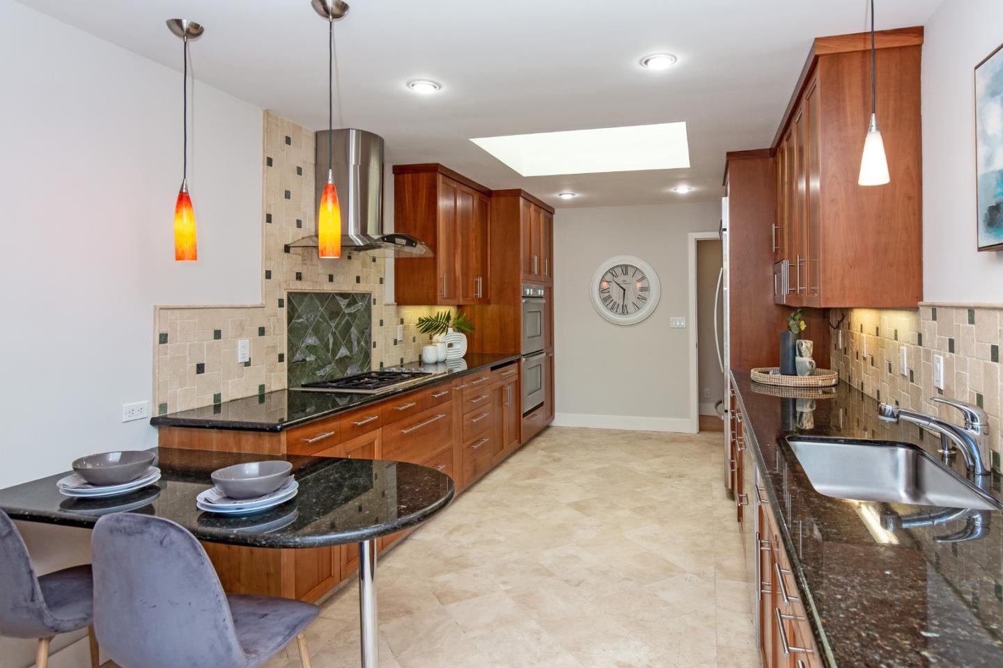 576 Bush Street Mountain View, CA 94041 - Photo 6 of 21 a kitchen with stainless steel appliances granite countertop a sink a stove and a wooden floors