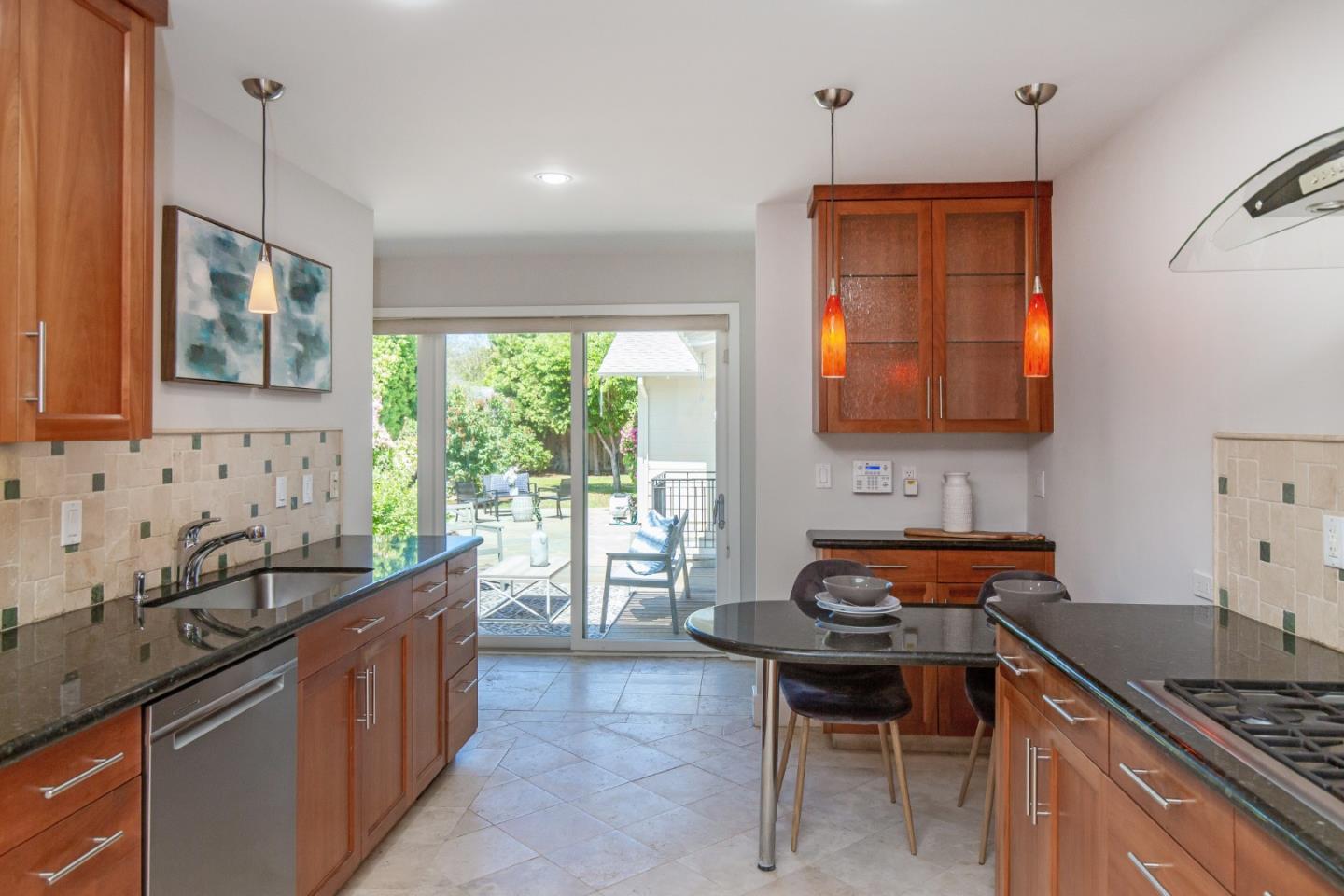 576 Bush Street Mountain View, CA 94041 - Photo 7 of 21 a kitchen with stainless steel appliances granite countertop a sink stove and refrigerator