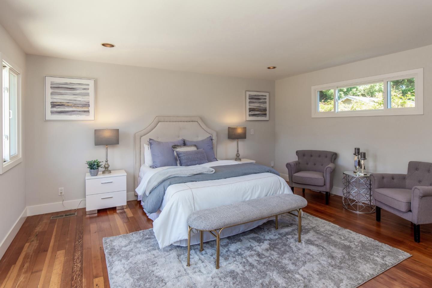 576 Bush Street Mountain View, CA 94041 - Photo 10 of 21 a bedroom with a bed and wooden floor