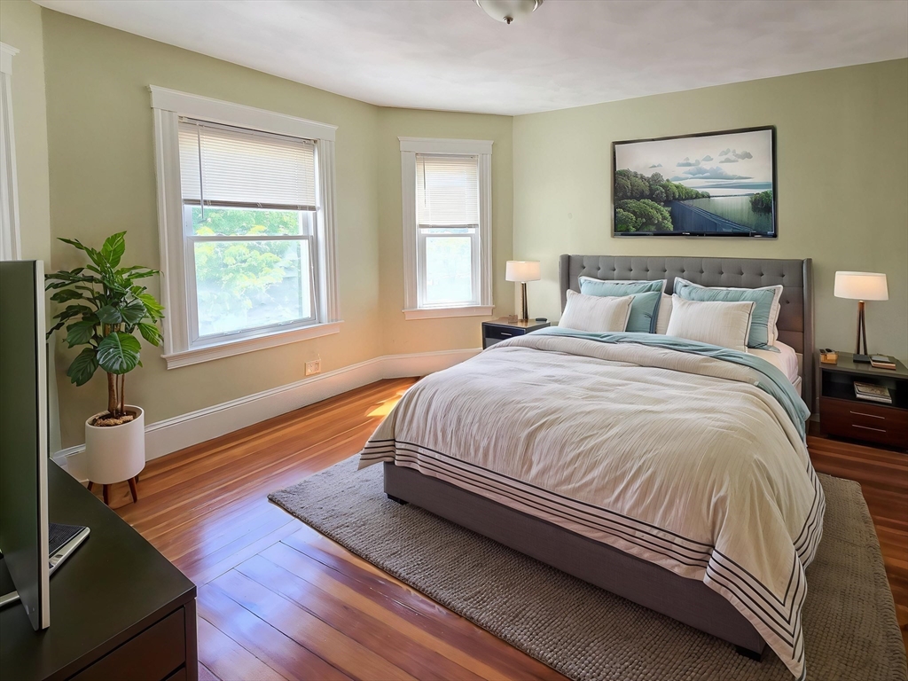 23 Ralph Piteri Terrace, Unit 3 Watertown, MA 02472 - Photo 4 of 7 a spacious bedroom with a bed and window
