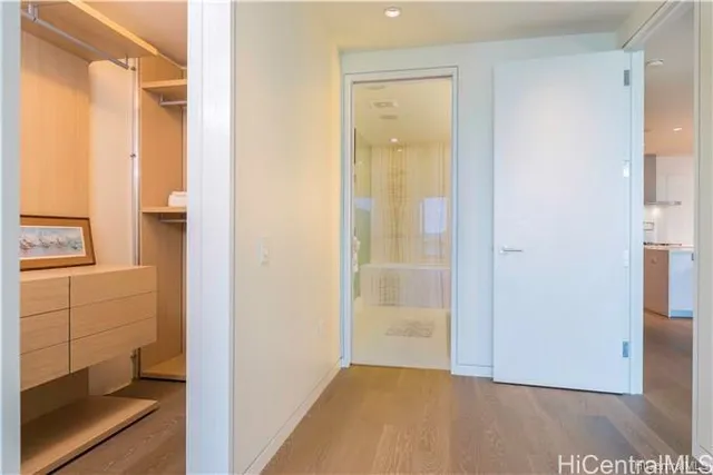 a view of an entryway with wooden floor