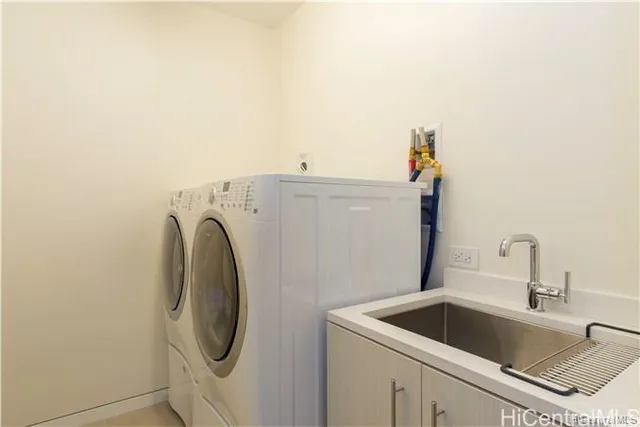 a utility room with dryer and washer