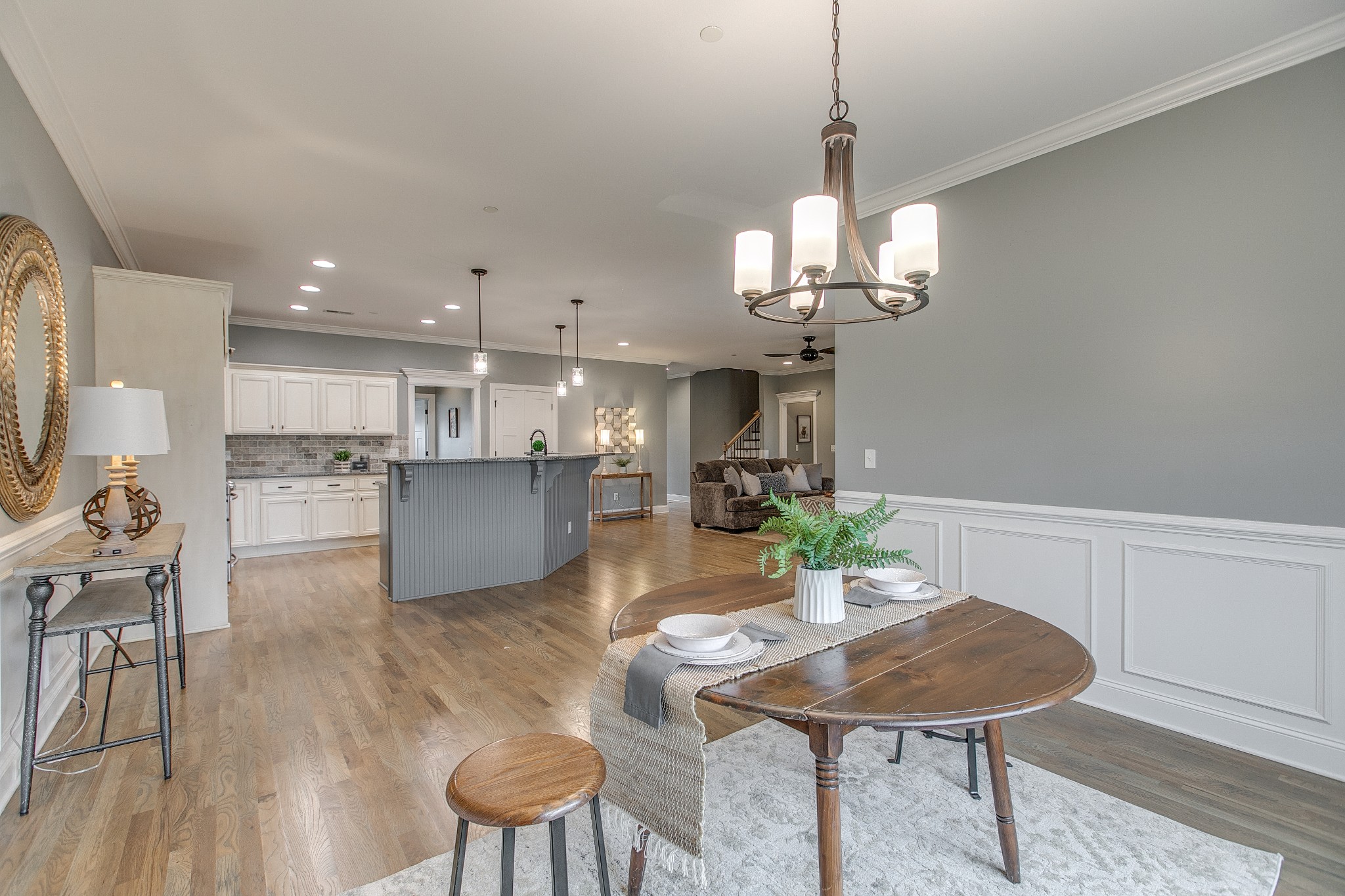 1102 Cascadeway Drive Murfreesboro, TN 37129 - Photo 14 of 45 a living room with kitchen island furniture and a chandelier