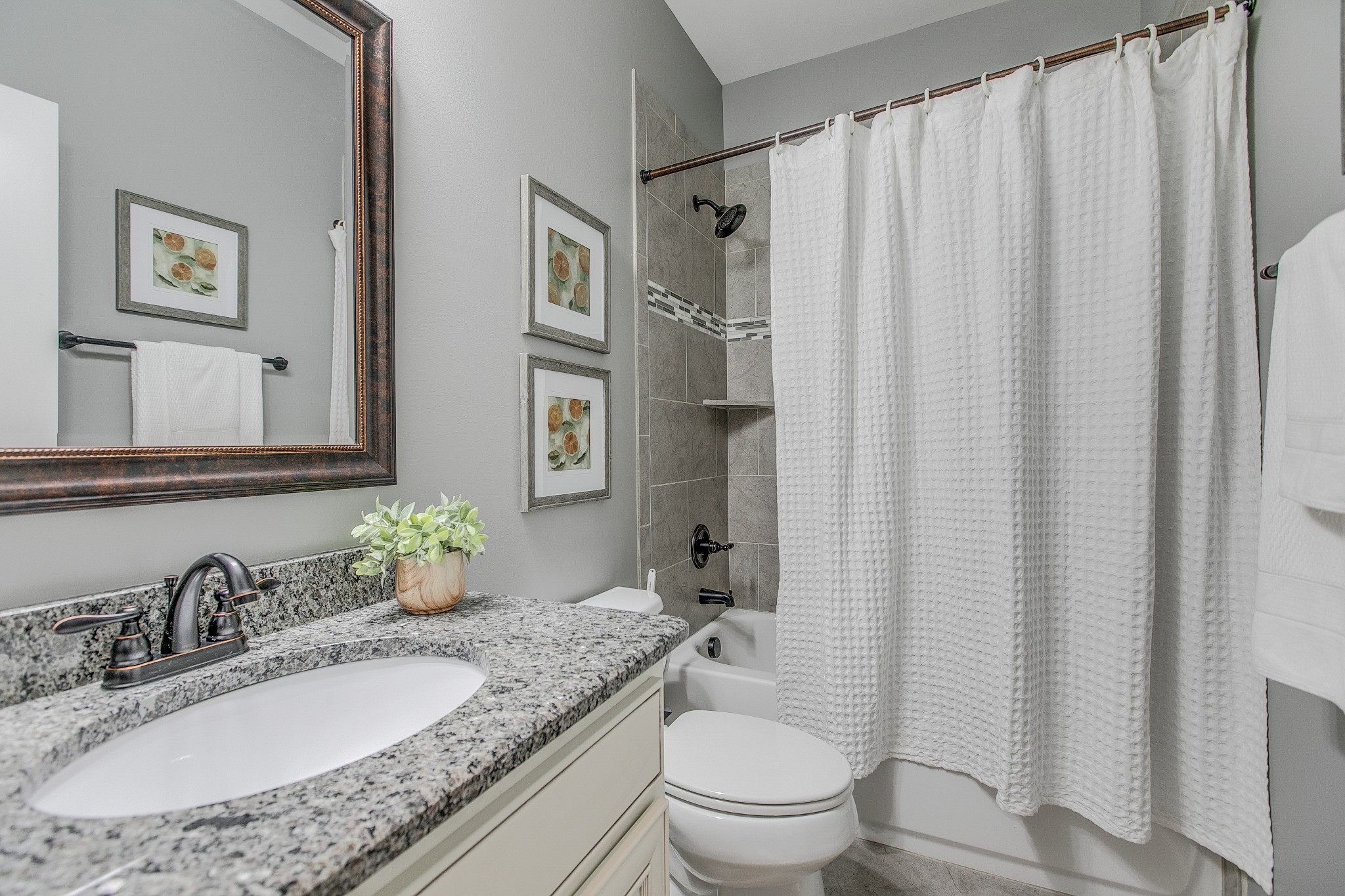 1102 Cascadeway Drive Murfreesboro, TN 37129 - Photo 18 of 45 a bathroom with a granite countertop sink and a mirror