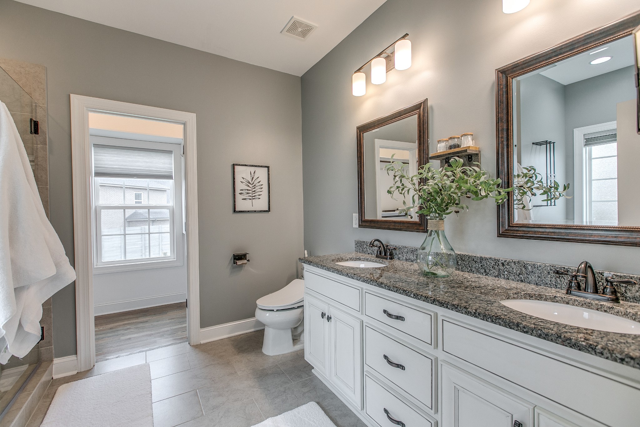 1102 Cascadeway Drive Murfreesboro, TN 37129 - Photo 23 of 45 a bathroom with a granite countertop sink mirror and a bathtub