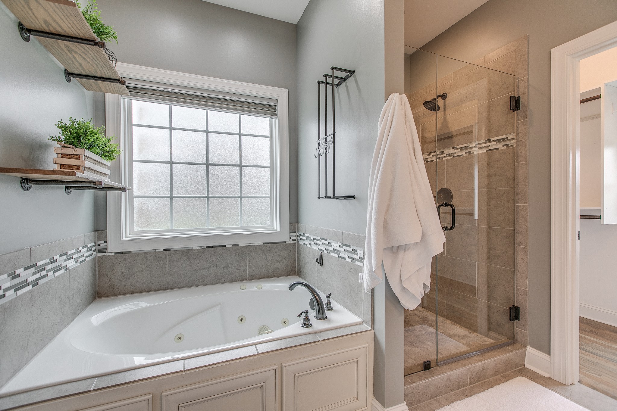 1102 Cascadeway Drive Murfreesboro, TN 37129 - Photo 24 of 45 a bathroom with a tub a window and a shower