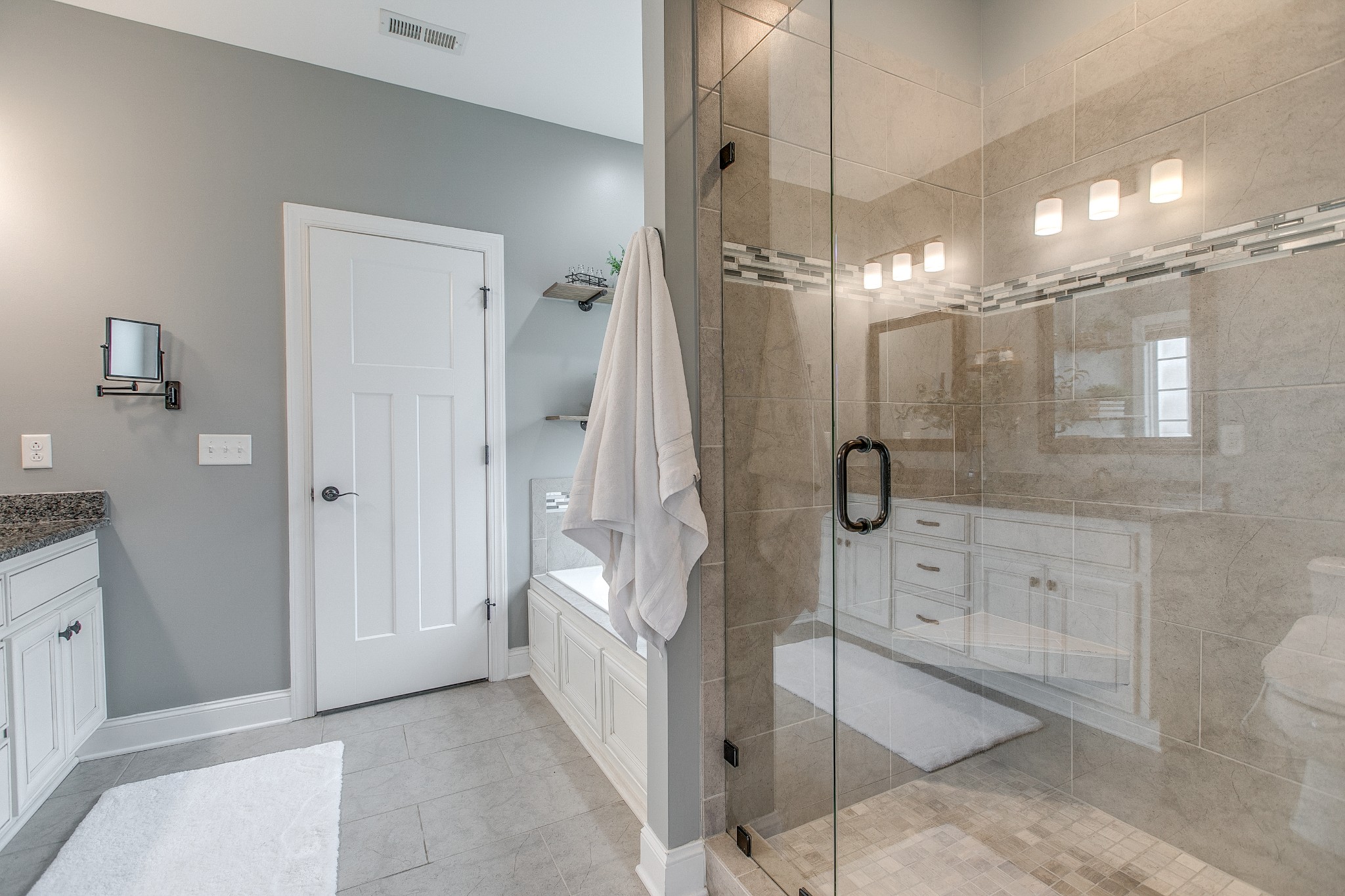 1102 Cascadeway Drive Murfreesboro, TN 37129 - Photo 25 of 45 a bathroom with a shower a sink and mirror