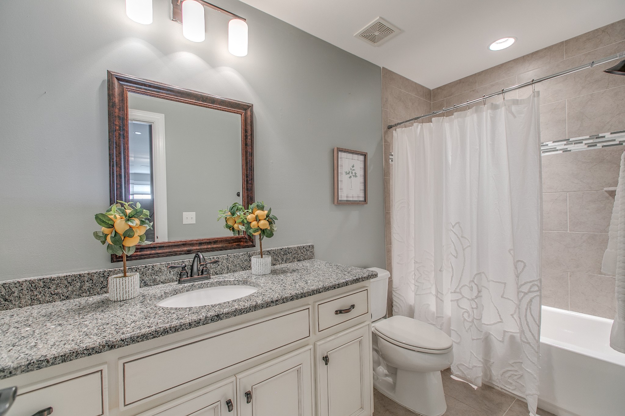 1102 Cascadeway Drive Murfreesboro, TN 37129 - Photo 28 of 45 a bathroom with a granite countertop sink a toilet and mirror
