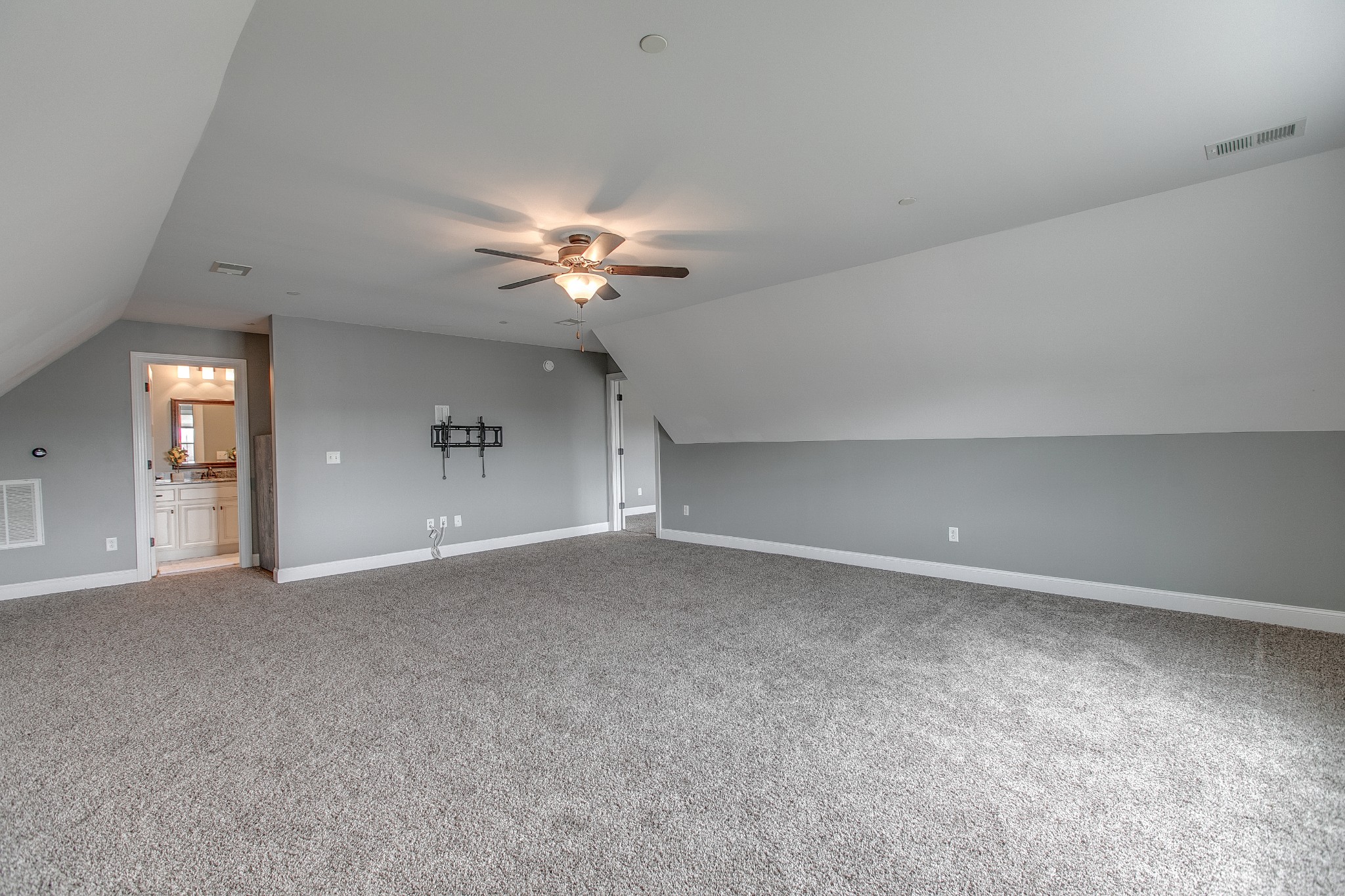 1102 Cascadeway Drive Murfreesboro, TN 37129 - Photo 31 of 45 a view of an empty room with a chandelier fan