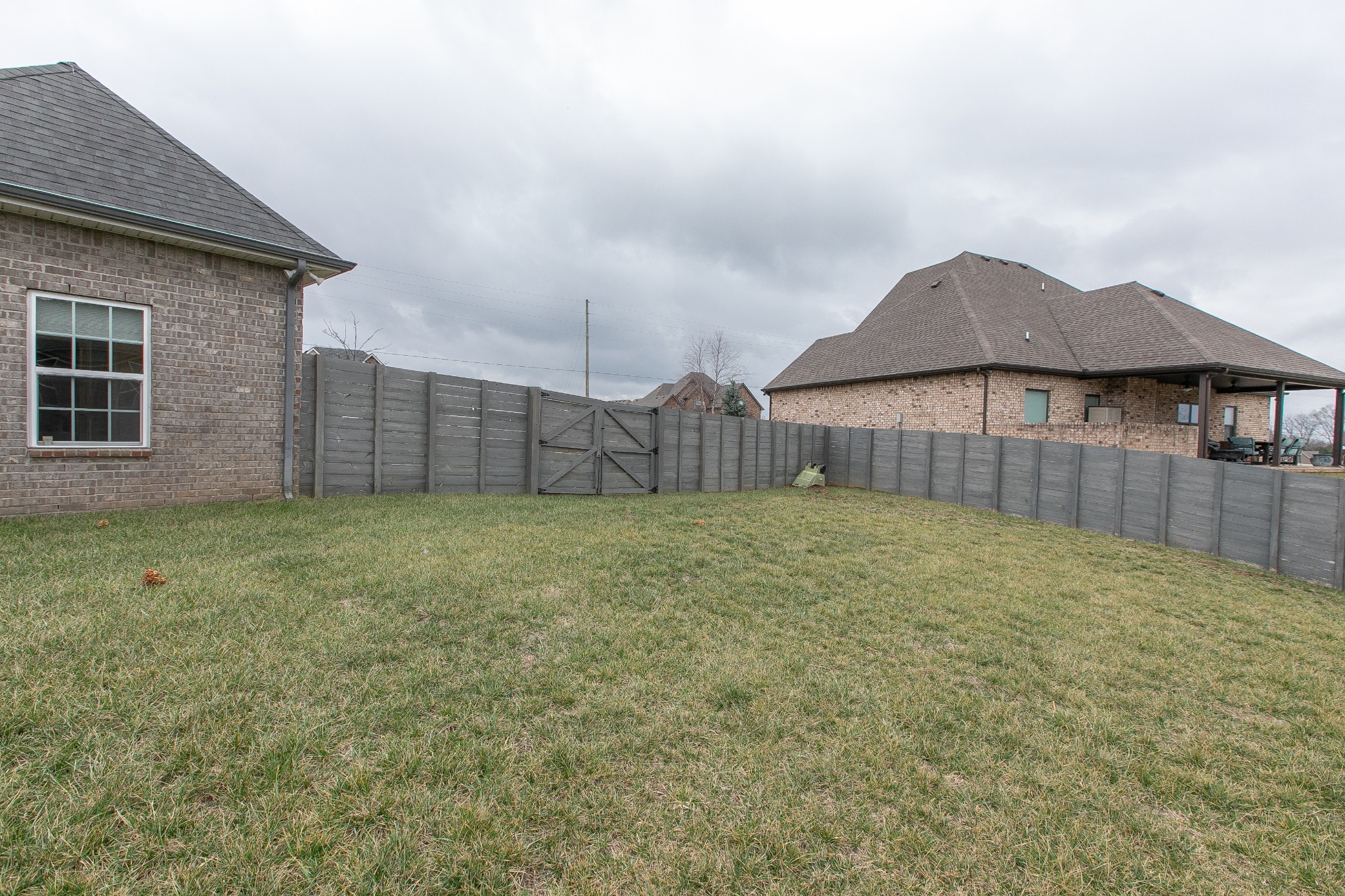 1102 Cascadeway Drive Murfreesboro, TN 37129 - Photo 39 of 45 a view of a backyard with a barbeque grill and wooden fence