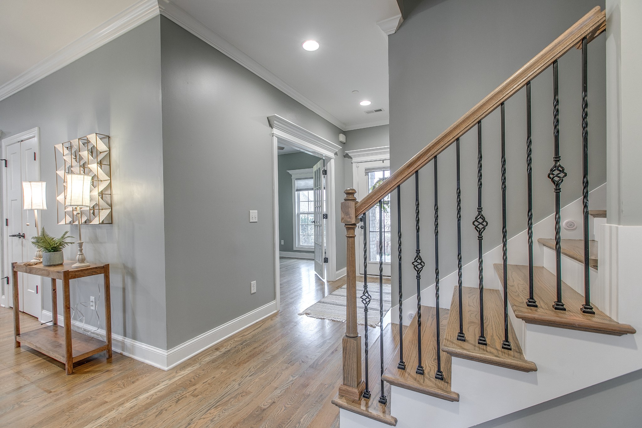 1102 Cascadeway Drive Murfreesboro, TN 37129 - Photo 7 of 45 a view of a hallway with wooden floor and staircase
