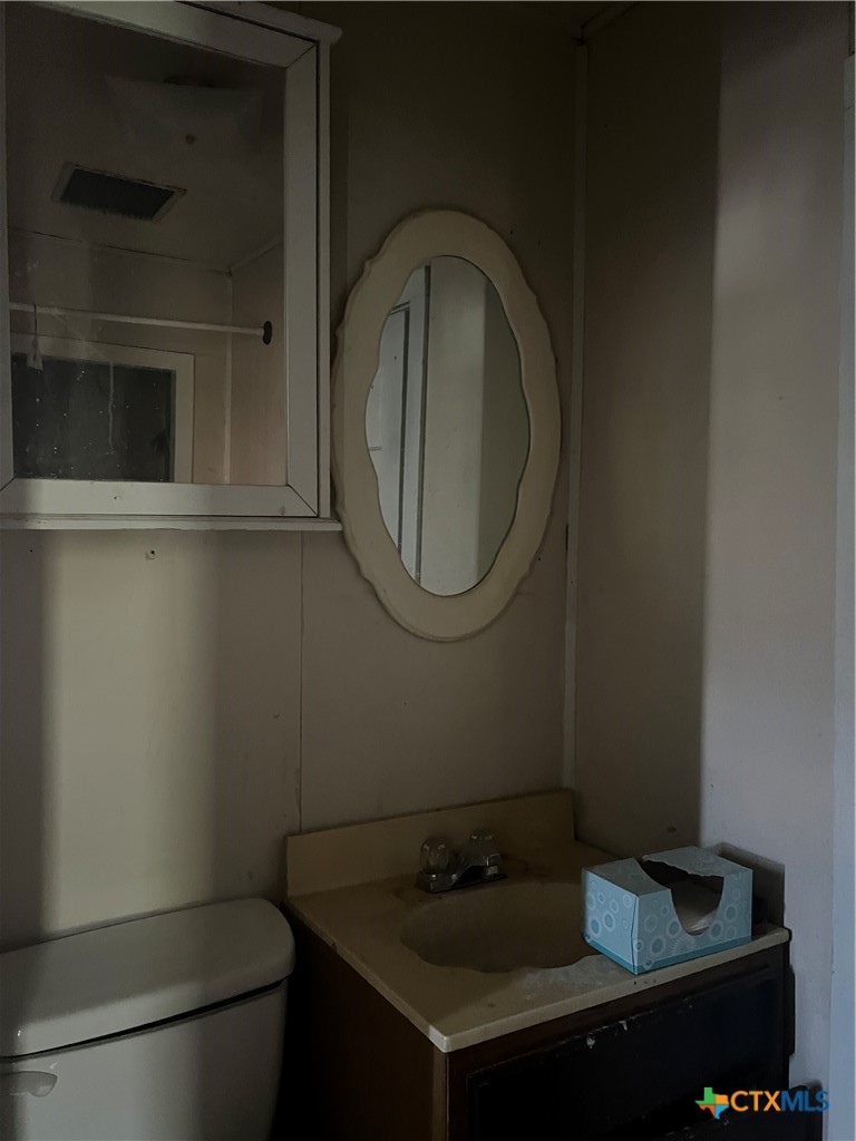 612 South 7th Street Temple, TX 76504 - Photo 11 of 43 a bathroom with a sink and a toilet