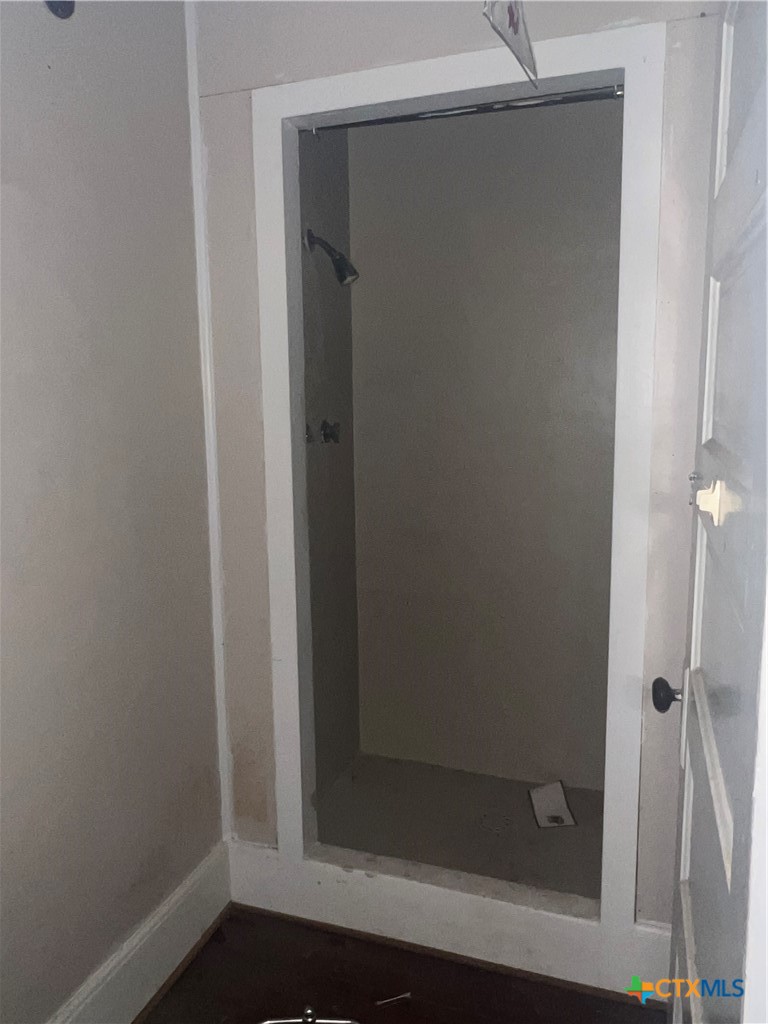 612 South 7th Street Temple, TX 76504 - Photo 12 of 43 a bathroom with a glass shower door